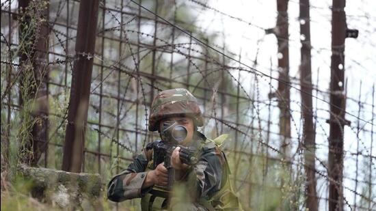 A soldier takes position during a drill along the Line of Control in Nowshera sector, 127km from Jammu, earlier this week. (AP Photo)