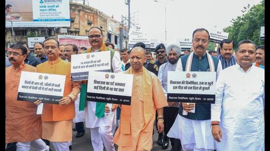 Chief minister Yogi Adityanath with deputy CMs Brajesh Pathak, Keshav Prasad Maurya, BJP MP Dinesh Sharma and others participates in the Silent March organised from Sardar Vallabhbhai Patel’s statue towards Lok Bhavan as part of the ‘Har Ghar Tiranga’ campaign commemorating the 78th Independence Day, in Lucknow on Wednesday. (ANI Photo)