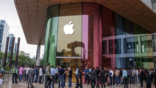 Customers queue outside an Apple Inc. store ahead of its opening hours during the first day of sale of the iPhone 15 smartphone in Mumbai. (Bloomberg)