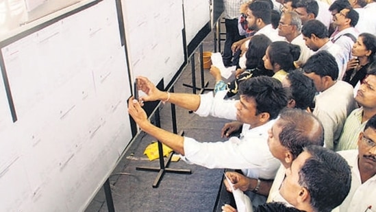 Mumbai, India - 24 Feb. 2016 : People checking out there name in the list of MHADA lottery results were to be announced at Rang Sharda Hotel,Bandra in Mumbai, India, on Wednesday, February 24, 2016. (Photo by Pramod Thakur/ Hindustan Times) (Hindustan Times) Mumbai, India - 24 Feb. 2016 : People checking out there name in the list of MHADA lottery results were to be announced at Rang Sharda Hotel,Bandra in Mumbai, India, on Wednesday, February 24, 2016. (Photo by Pramod Thakur/ Hindustan Times) (Hindustan Times)