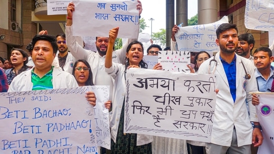 New Delhi: Doctors stage a protest over the sexual assault and murder of a postgraduate trainee doctor in Kolkata, at Ram Manohar Lohia Hospital, in New Delhi, Wednesday, Aug. 14, 2024. (PTI Photo)