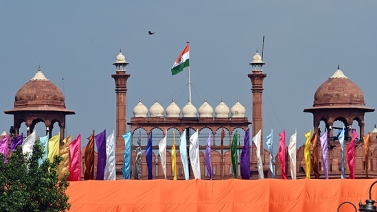 Colored flags are seen fluttering in front of Red Fort, the main venue for the Independence Day celebrations, in New Delhi, India, on Wednesday, August 14, 2024. (Photo by Sanjeev Verma/ Hindustan Times)