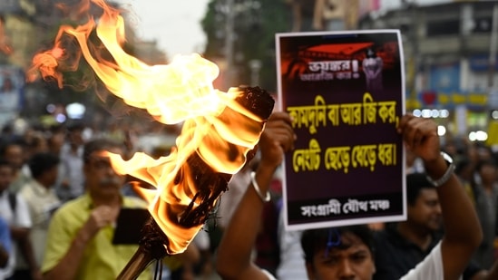 Members of different organisations take out a protest rally in solidarity with agitating doctors and other medical professionals over the alleged rape and murder of a PGT woman doctor at RG Kar Medical College and Hospital in Kolkata on August 13, 2024. (Samir Jana/ Hindustan Times)