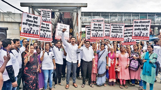 The Thane Diva Railway Passenger Association on Wednesday protested in front of the Diva railway station demanding that trains for CSMT start from Diva and long-distance trains to Konkan halt at the station. (Praful Gangurde /HT Photo)