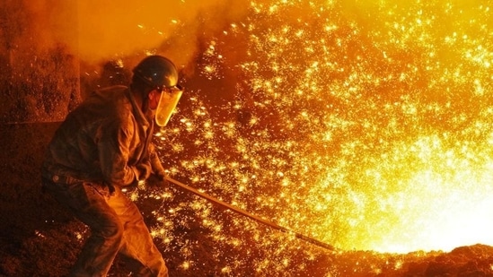 Latest news on August 14, 2024: An employee works next to molten iron at a steel mill of Dongbei Special Steel in Dalian, Liaoning province, China. (Stringer/REUTERS)