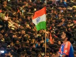 The T20 World Cup-winning Indian cricket team captain Rohit Sharma holds the Indian tricolour during open bus victory parade The T20 World Cup-winning Indian cricket team captain Rohit Sharma holds the Indian tricolour during open bus victory parade