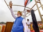 Prime Minister Narendra Modi greets the gathering at the Red Fort after hoisting the national flag on 78th Independence Day. Prime Minister Narendra Modi greets the gathering at the Red Fort after hoisting the national flag on 78th Independence Day.