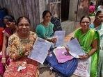 Women collect their scheme certificates in Thane. ( Praful Gangurde / HT Photo ) Women collect their scheme certificates in Thane. ( Praful Gangurde / HT Photo )