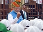 Prime Minister Narendra Modi greets children at the Red Fort on 78th Independence Day, in New Delhi, India, on Thursday, August 15, 2024.( Sanjeev Verma/ Hindustan Times)