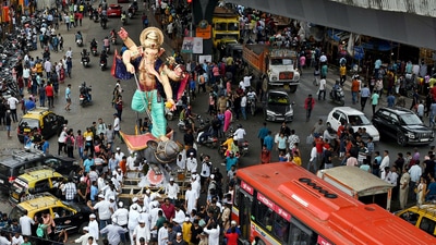 A giant idol of Lord Ganesha being brought by the devotees towards a pandal ahead of the Ganesh Chaturthi festival. (ANI Photo) (Ashish Vaishnav) A giant idol of Lord Ganesha being brought by the devotees towards a pandal ahead of the Ganesh Chaturthi festival. (ANI Photo) (Ashish Vaishnav)