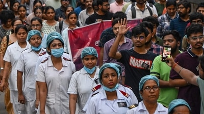 Medical professionals and students participate in a silent march as they condemn the rape and murder of a doctor, in Kolkata on August 15, 2024. (AFP) Medical professionals and students participate in a silent march as they condemn the rape and murder of a doctor, in Kolkata on August 15, 2024. (AFP)