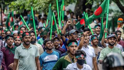 Protesters hold national flags as they march to block the house of Sheikh Mujibur Rahman, ‘Bangabandhu’ the first president of independent Bangladesh and father of ousted ex-premier Sheikh Hasina, on Thursday, to mark the anniversary of his assassination. (AFP) Protesters hold national flags as they march to block the house of Sheikh Mujibur Rahman, ‘Bangabandhu’ the first president of independent Bangladesh and father of ousted ex-premier Sheikh Hasina, on Thursday, to mark the anniversary of his assassination. (AFP)