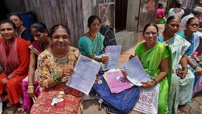 Women collect their scheme certificates in Thane. ( Praful Gangurde / HT Photo )