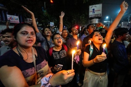 Students join other protesters in a midnight rally protesting against the murder of a 31 year old post-graduate trainee demanding proper investigation in Kolkata, India, Wednesday, Aug. 14, 2024. (AP)