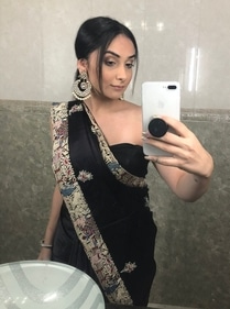 Natasha Patel in a black Gara saree styled with a strapless blouse