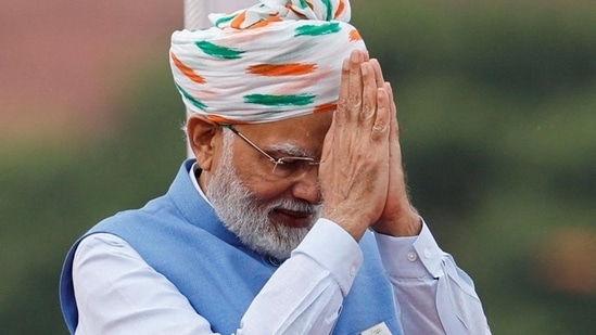 In 2022, Modi made a statement by choosing a safa that paid homage to the national flag. It featured the tricolours's motifs and a long trail. He wore a traditional white kurta, churidar pants, and a powder blue jacket.&nbsp;(File Photo/Reuters)