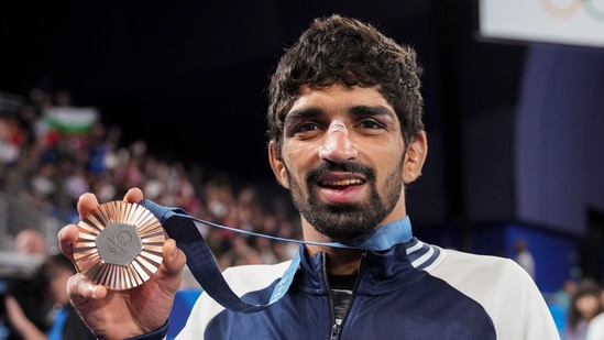 Paris: Bronze medalist India's Aman Sehrawat poses for photos during the victory ceremony for the men's 57kg free-style wrestling(PTI)