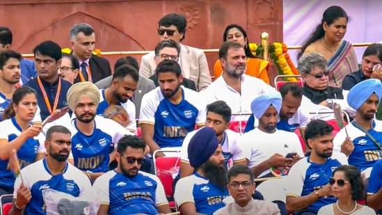 Leader of Opposition in Lok Sabha Rahul Gandhi with the Paris Olympics 2024 medal winning contingent and others during the 78th Independence Day celebration at the Red Fort.(PTI)