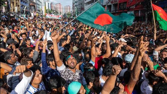 People gather in front of the Bangladesh Nationalist Party (BNP) headquarters during a rally in Dhaka, Bangladesh (AP Photo)