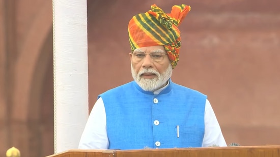 Prime Minister Narendra Modi addressed the nation at the Red Fort in New Delhi on August 15. Modi becomes the third prime minister to deliver 11 consecutive speeches on Independence Day, after Jawaharlal Nehru and Indira Gandhi. Today, he sported a multi-coloured Rajasthani leheriya print turban with a white kurta set, blue bandhgala jacket, and churidar for the 78th Independence Day celebrations. Here's a look at iconic headgear and traditional looks he sported during the Independence Day celebrations at the Red Fort in the last 10 years. (Youtube)