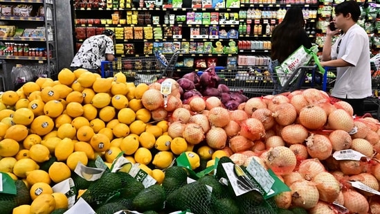 People shop at a grocery store in Rosemead, California. US consumer inflation eased slightly in July, according to US Labor Department data.(AFP)