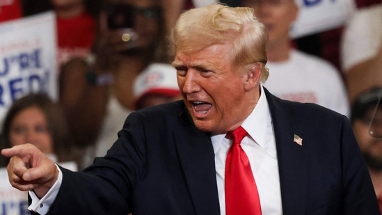 Former US President and 2024 Republican presidential candidate Donald Trump arrives to speak during a campaign rally at the Georgia (AFP)