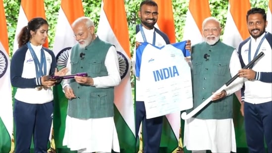 Prime Minister Narendra Modi with Olympic medallists.