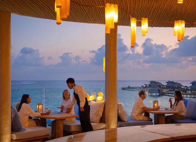 The open-air dining area looks out on the waters of the lagoon. The open-air dining area looks out on the waters of the lagoon.