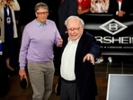 Berkshire Hathaway CEO Warren Buffett (R) talks to Microsoft founder Bill Gates as they play Bridge during the Berkshire Hathaway annual meeting weekend.