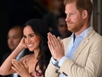 Britain's Prince Harry (C), Duke of Sussex, and his wife Meghan Markle react while attending a show during a visit to the National Centre for the Arts in Bogota on August 15, 2024. Prince Harry and his wife, American actress Meghan Markle, arrived in Colombia at the invitation of Marquez, with whom they will attend various meetings with women and young people to reject discrimination and cyberbullying. (Photo by RAUL ARBOLEDA / AFP) Britain's Prince Harry (C), Duke of Sussex, and his wife Meghan Markle react while attending a show during a visit to the National Centre for the Arts in Bogota on August 15, 2024. Prince Harry and his wife, American actress Meghan Markle, arrived in Colombia at the invitation of Marquez, with whom they will attend various meetings with women and young people to reject discrimination and cyberbullying. (Photo by RAUL ARBOLEDA / AFP)