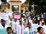 Resident doctors of BHU take part in a march demanding justice for RG Kar Medical College rape and murder victim in Varanasi on Friday. Resident doctors of BHU take part in a march demanding justice for RG Kar Medical College rape and murder victim in Varanasi on Friday.