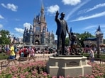 FILE PHOTO: People gather at the Magic Kingdom theme park before the "Festival of Fantasy" parade at Walt Disney World in Orlando, Florida, U.S. July 30, 2022. 