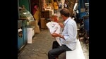 Immersed: Reading an Urdu newspaper in Kolkata (Shutterstock)