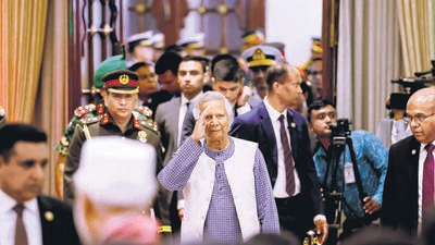Nobel laureate Muhammad Yunus salutes to the attendees upon arrival at the Bangabhaban to take oath as the head of the interim government, in Dhaka, Bangladesh, on August 8. (REUTERS) Nobel laureate Muhammad Yunus salutes to the attendees upon arrival at the Bangabhaban to take oath as the head of the interim government, in Dhaka, Bangladesh, on August 8. (REUTERS)