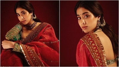 Janhvi Kapoor poses in a luxurious organza saree and contrasting green blouse. (Instagram ) Janhvi Kapoor poses in a luxurious organza saree and contrasting green blouse. (Instagram )