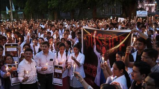 Doctors take part in a candlelight protest against the alleged rape and murder of RG Kar Medical College and Hospital trainee doctor, in Nagpur on Friday. (ANI)