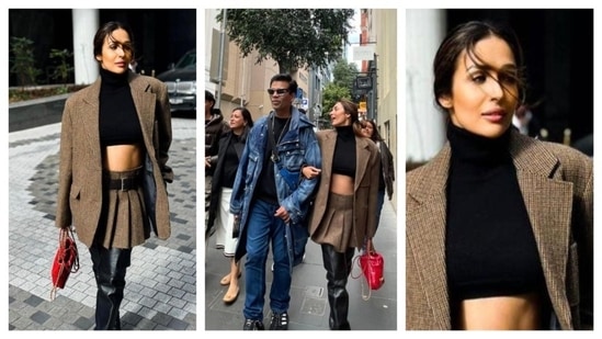 Malaika Arora attended the Indian Film Festival in Melbourne in a brown co-ord set that radiated with ‘dark academia’ vibes. She wore a high-neck black crop top with a pleated brown skirt. Layering it with an oversized brown blazer, she added a touch of colour with her red handbag. She was spotted with Karan Johar in denim overalls.(Instagram/@malaikaaroraofficial)