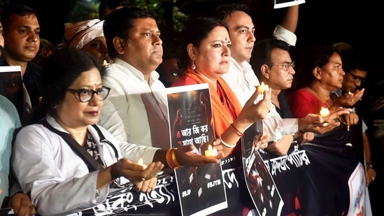 Union Minister of State and BJP state President Sukanta Majumdar, party leader Agnimitra Paul and others during a candlelight march for the victim of the RG Kar Medical College and Hospital murder case (PTI Photo)