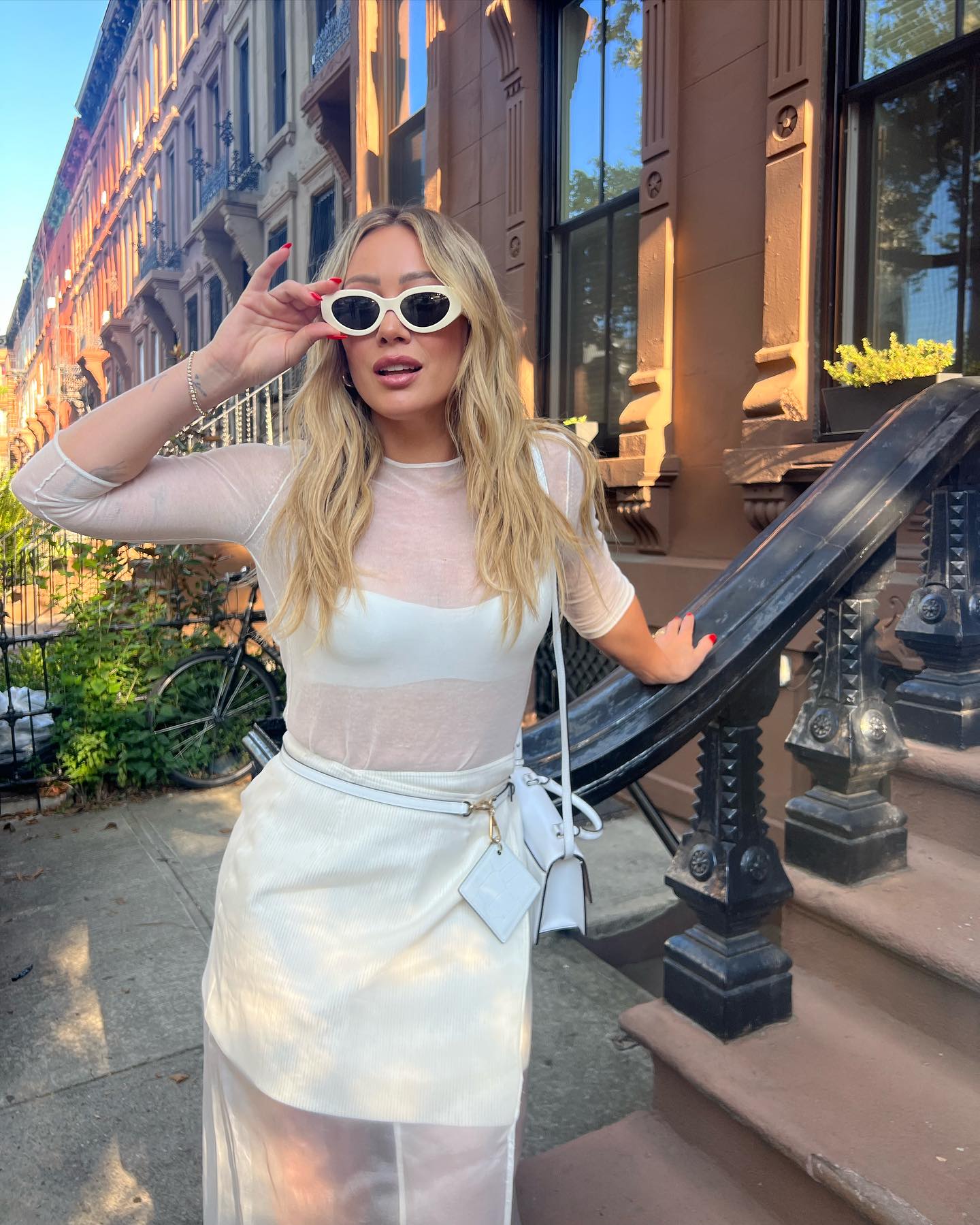 Hilary Duff in a white sheer dress. Hilary Duff in a white sheer dress.