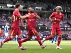 Liverpool's Mohamed Salah, center, celebrates after he scores his side's second goal during the English Premier League soccer match between Ipswich Town and Liverpool Liverpool's Mohamed Salah, center, celebrates after he scores his side's second goal during the English Premier League soccer match between Ipswich Town and Liverpool
