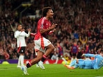 Manchester United's Joshua Zirkzee celebrates scoring their side's first goal of the game during a Premier League soccer match against Fulham at Old Trafford in Manchester