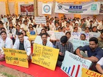 Doctors hold placards during a protest at the Freedom Park in Bengaluru on Friday. Doctors hold placards during a protest at the Freedom Park in Bengaluru on Friday.
