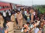 Police personnel during a rescue operarion after coaches of the Sabarmati Express passenger train derailed between Kanpur and Bhimsen station in Uttar Pradesh, on Saturday. Police personnel during a rescue operarion after coaches of the Sabarmati Express passenger train derailed between Kanpur and Bhimsen station in Uttar Pradesh, on Saturday.