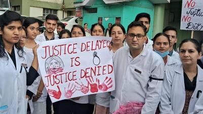 Doctors holding a placard during the protest outside IGMCShimla. (Deepak Sansta/HT) Doctors holding a placard during the protest outside IGMCShimla. (Deepak Sansta/HT)