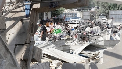 A man inspects the damage to a building after an Israeli strike in the southern town of Kfour, in the Nabatiyeh district, on August 17, 2024 (Photo by Mahmoud ZAYYAT / AFP) (AFP) A man inspects the damage to a building after an Israeli strike in the southern town of Kfour, in the Nabatiyeh district, on August 17, 2024 (Photo by Mahmoud ZAYYAT / AFP) (AFP)