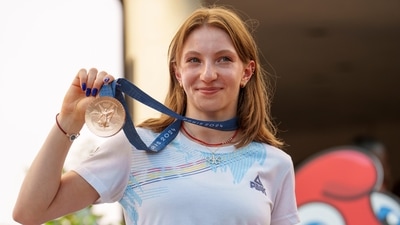 Romanian gymnast Ana Barbosu poses with the bronze medal for her women's artistic gymnastics individual floor performance at the Paris 2024 Olympics (AP) Romanian gymnast Ana Barbosu poses with the bronze medal for her women's artistic gymnastics individual floor performance at the Paris 2024 Olympics (AP)