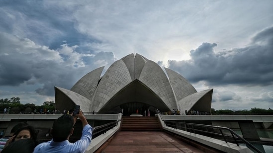 Visitors capture the marble marvel of Lotus Temple, situated in south Delhi. (Photo: Sanchit Khanna/HT)