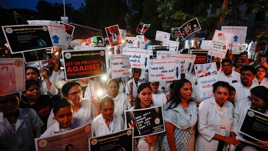 Doctors hold posters and shout slogans during a protest march demanding justice following the rape and murder of a trainee medic at a hospital in Kolkata, in Ahmedabad, India, August 17, 2024. REUTERS/Amit Dave(REUTERS)