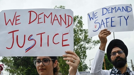 Doctors and medical students hold placards as they take part in a protest march in Amritsar on August 17, 2024, against the rape and murder of a doctor in India's West Bengal state.. (Photo by Narinder NANU / AFP)