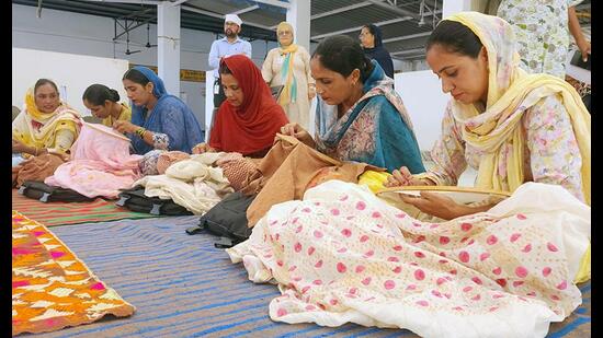 Rural women engaged in phulkari work at Ramsara village in Bathinda. (Sanjeev Kumar/HT)
